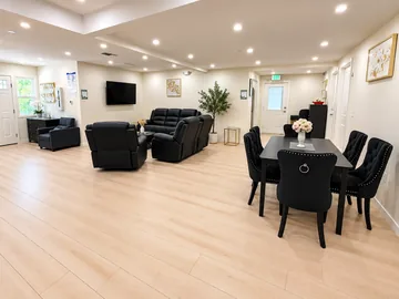 Open living and dining area with recliners and a dining table
